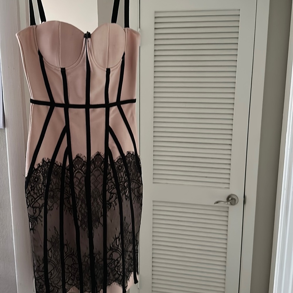 Pink midi dress with black lace design